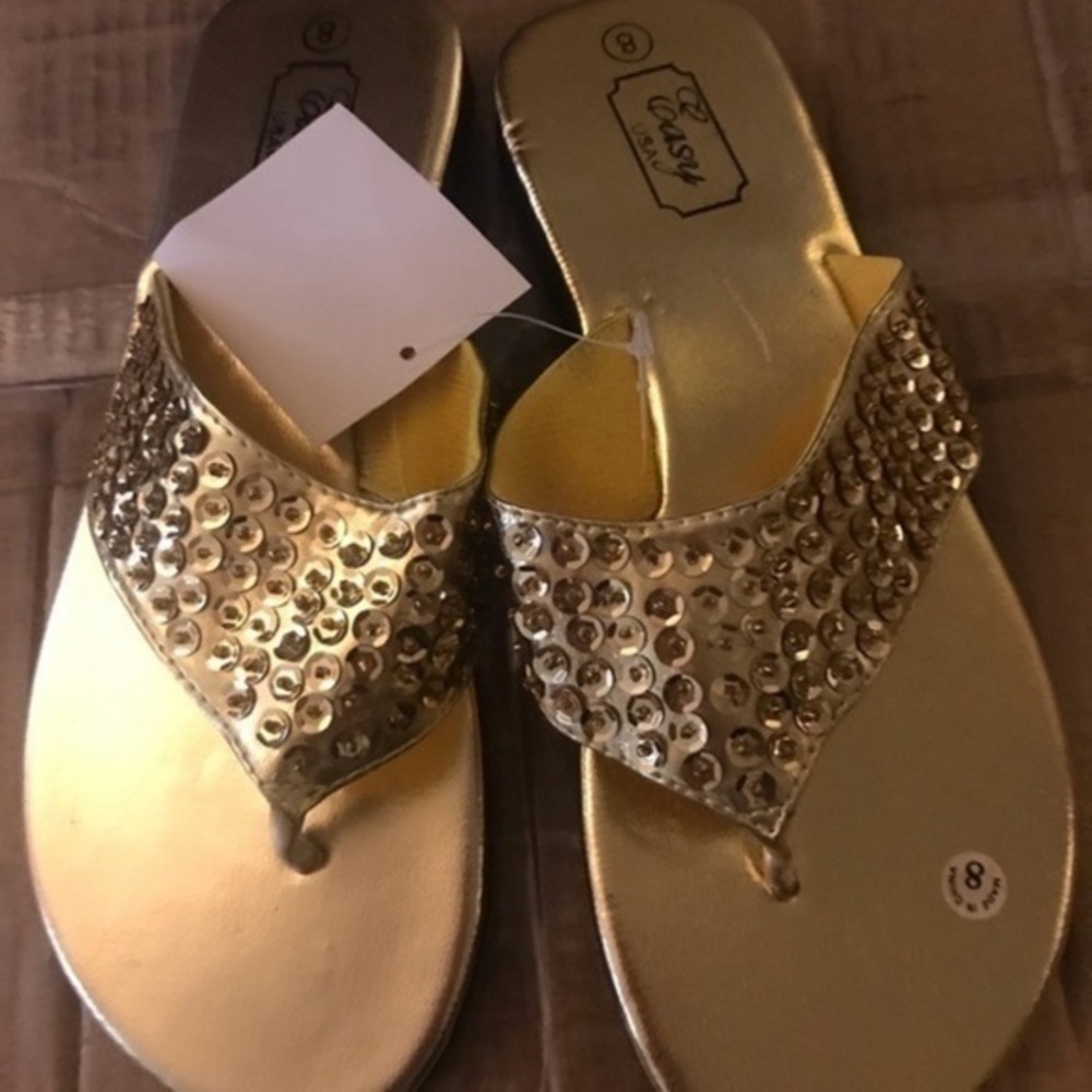 Gold rhinestone flip flops​